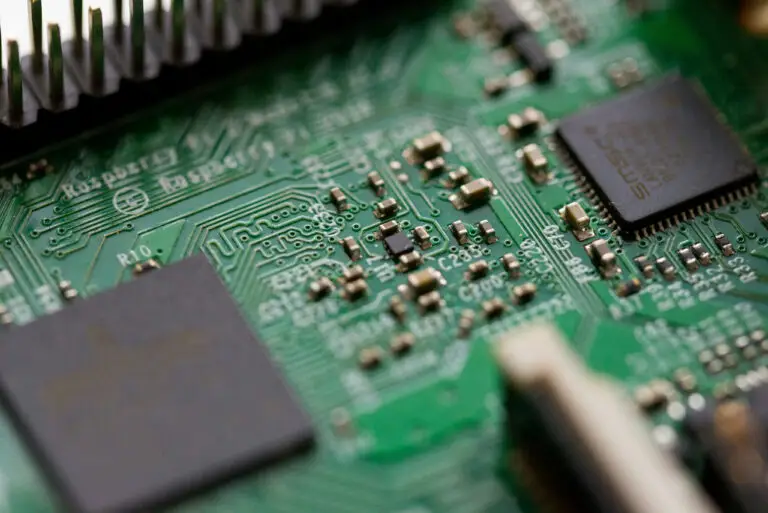 Close-up of a green circuit board with surface-mount components